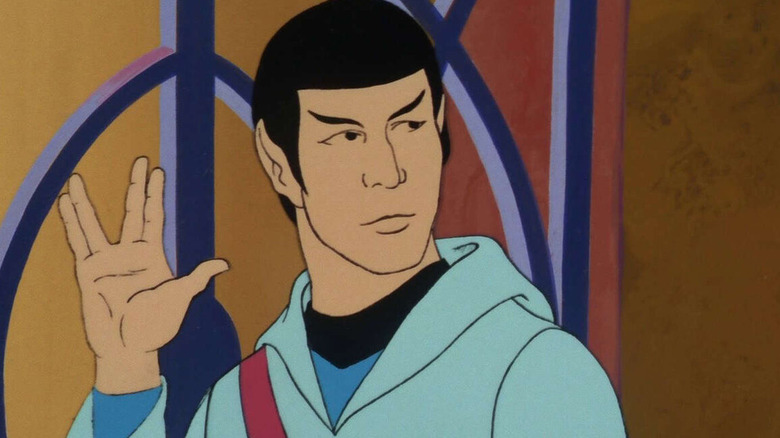 Spock looks right and gives the hand gesture