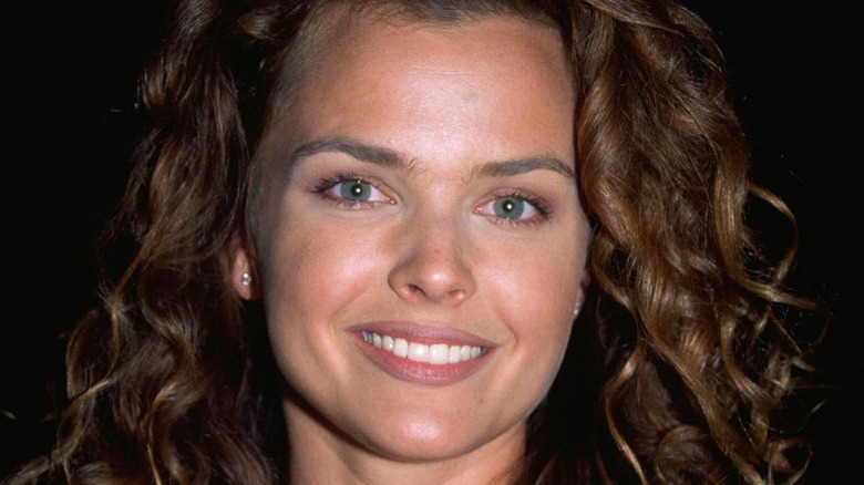 Dina Meyer poses at an event