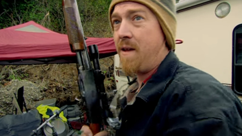 Greg Remsburg holding rifle