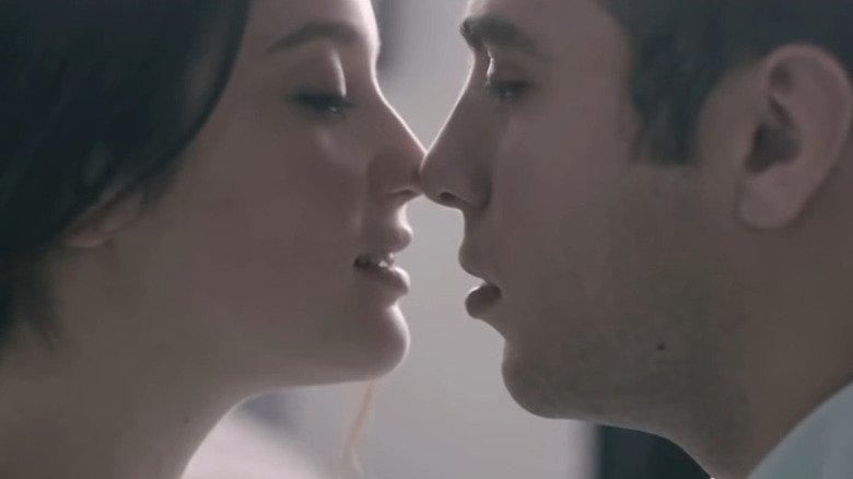 Laura and Carlos about to kiss