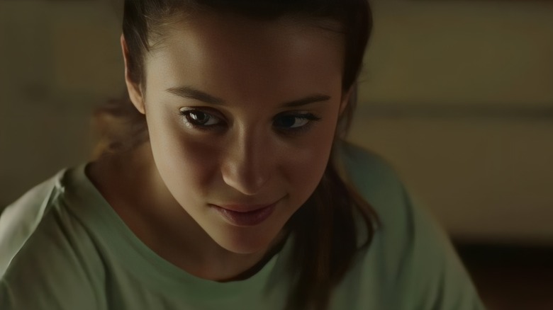 Laura smirking