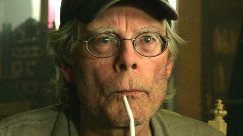 Stephen King sipping drink