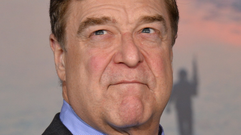 John goodman smiling to the camera's left