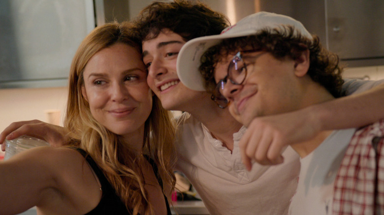 Cara Buono, Noah Schnapp, and Gaten Matarazzo posing for a picture in 