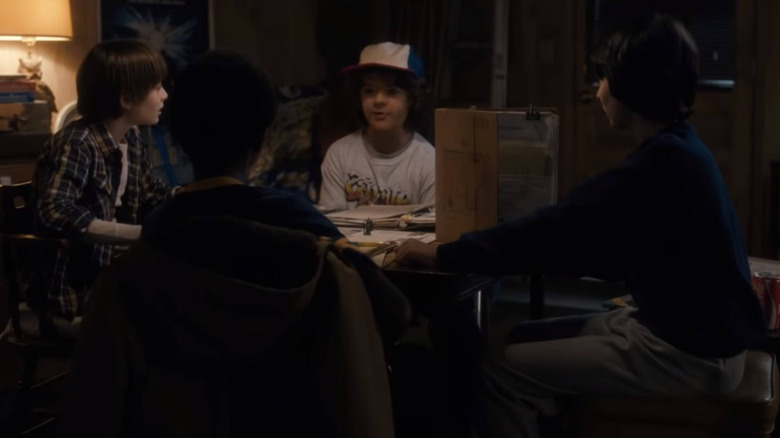 Will, Dustin, Mike, and Lucas playing Dungeons & Dragons on Stranger Things Season 1