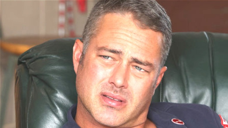 Taylor Kinney sitting in Chicago Fire