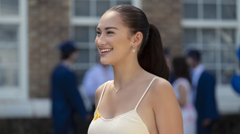 Belly smiling wearing white top