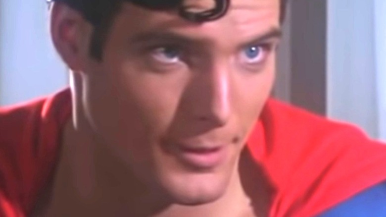 Superman looking at Lois and speaking to her