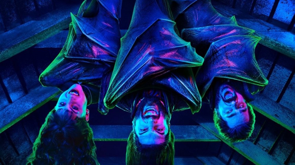 Nandor (Kayvan Novak), Laszlo (Matt Berry), and Nadja (Natasia Demetriou) hang around on What We Do in the Shadows poster