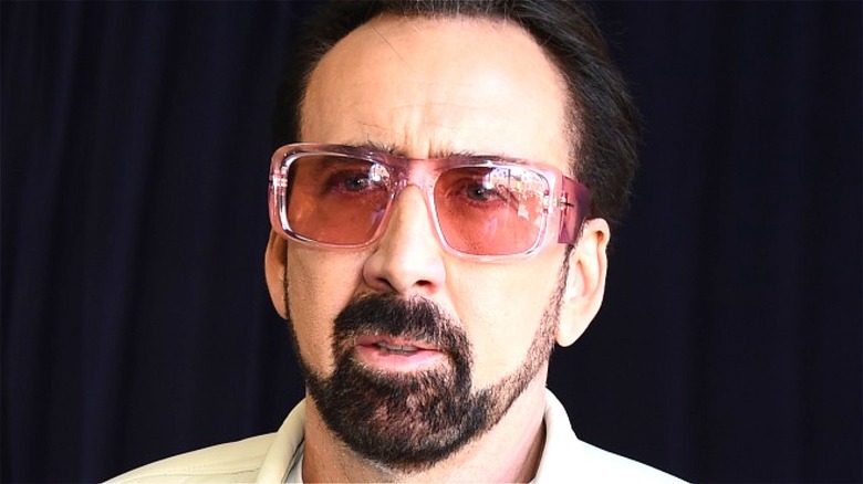 Can anyone identify what sunglasses Nic Cage is wearing in this pic ? : r/ sunglasses