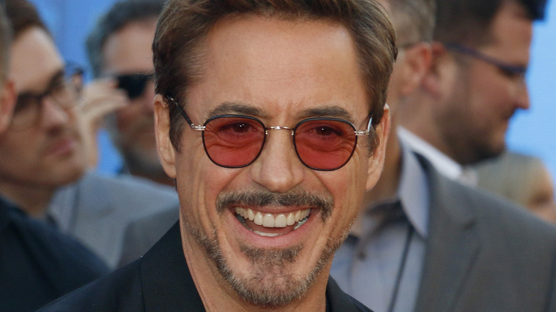 Robert Downey Jr. smiling and wearing red glasses