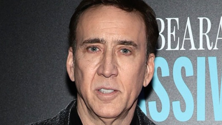 Nicolas Cage looking into camera