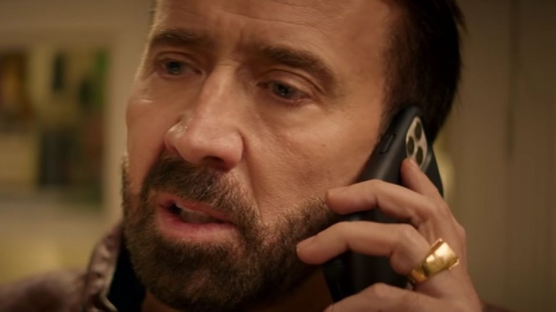 Nicolas Cage talking on cell phone