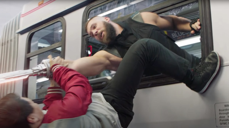 Simu Liu and Florian Munteanu as Shang-Chi and Razorfist in bus fight