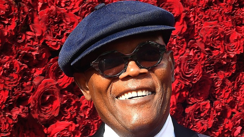 Samuel L. Jackson in front of a bed of roses