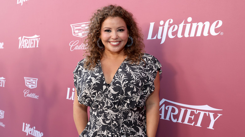 Justina Machado posing at a Lifetime event