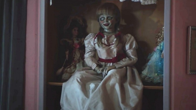 Annabelle doll on apartment shelf 