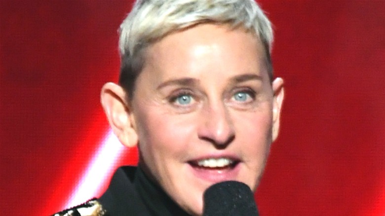 Ellen degeneres smiling into microphone