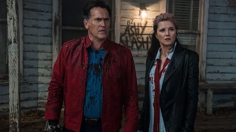 Lucy Lawless and Bruce Campbell standing together
