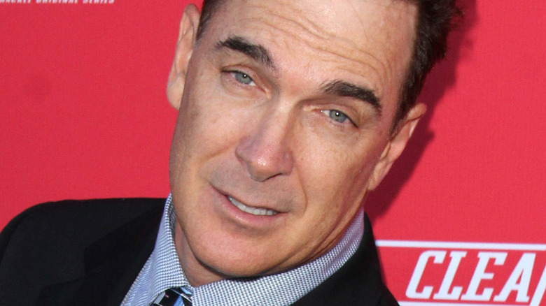 Patrick Warburton poses at an event.