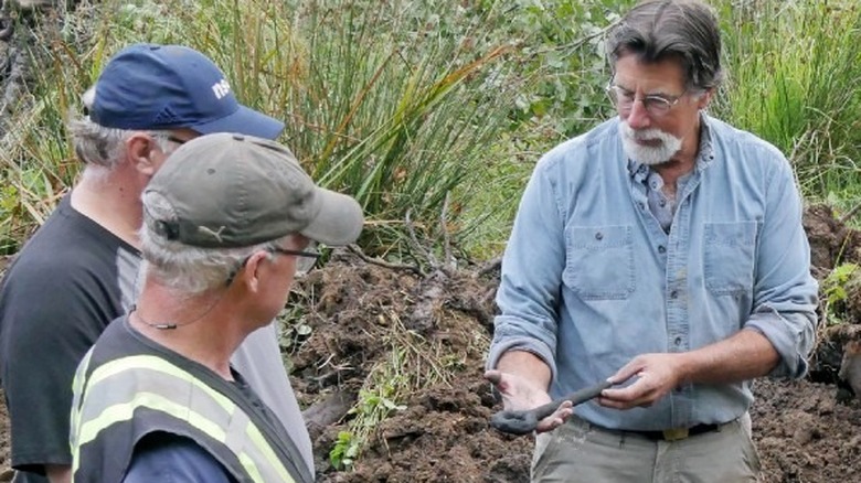 Rick Lagina holding find in The Curse of Oak Island 