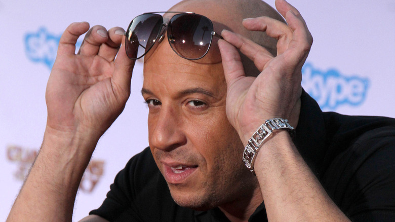 Vin Diesel posing for photographers.