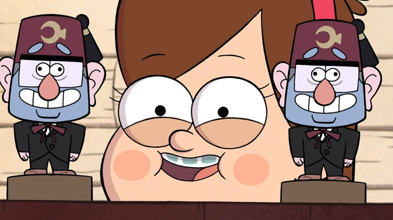 Mabel Pines smiling behind a shelf