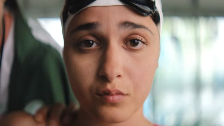 Yusra in swim cap upset