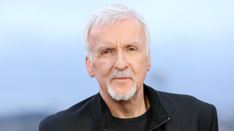 James Cameron posing for a photo at premiere