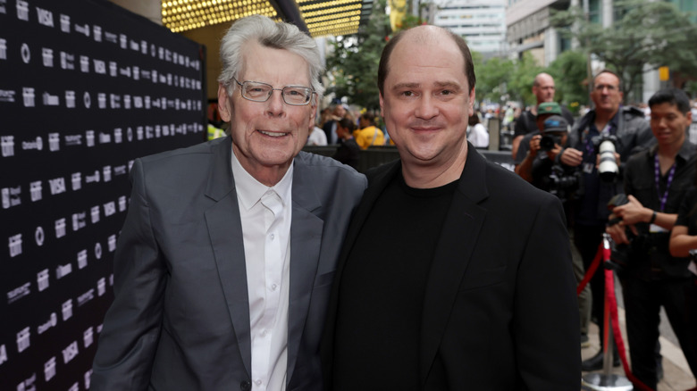 Stephen King and Mike Flanagan posing for a photo together