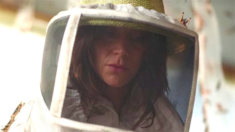 Woman in beekeeper suit