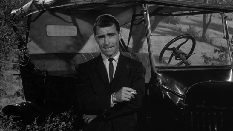 Rod Serling sitting in an old-fashioned car in The Last Rites of Jeff Myrtlebank