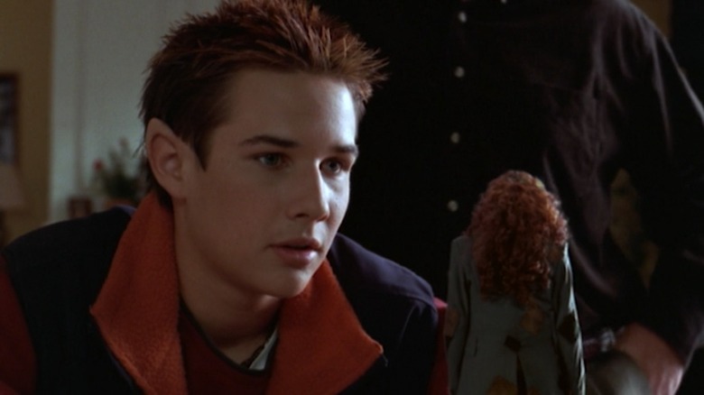 Kyle in The Luck of the Irish, looking at a leprechaun