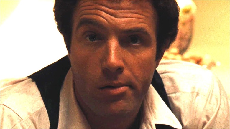 Sonny Corleone raising an eyebrow