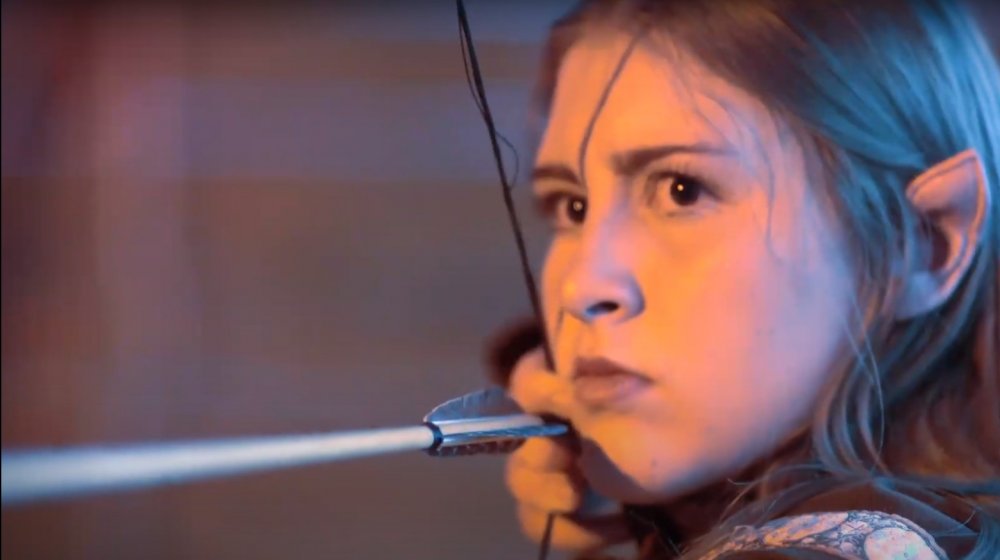 An Evermore cast member as an elven archer in a promotional image