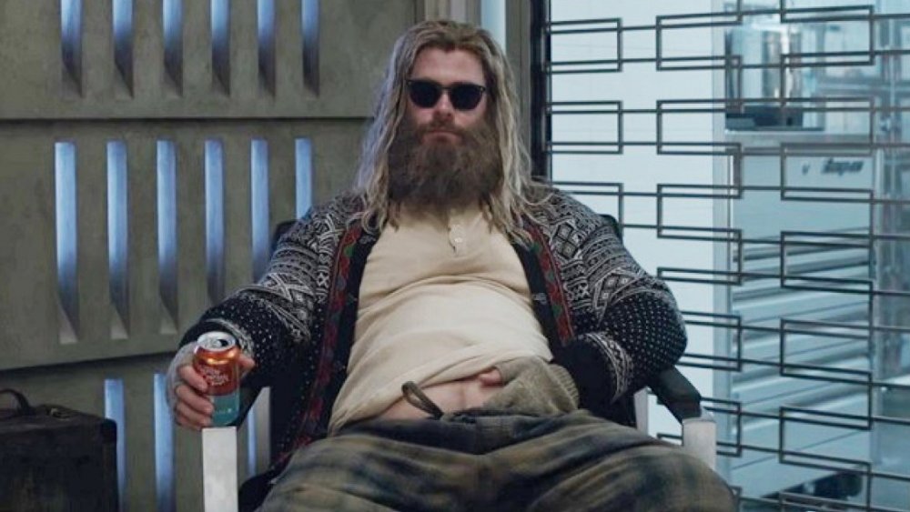 Chris Hemsworth as Thor, holding a can of beer, in Avengers: Endgame