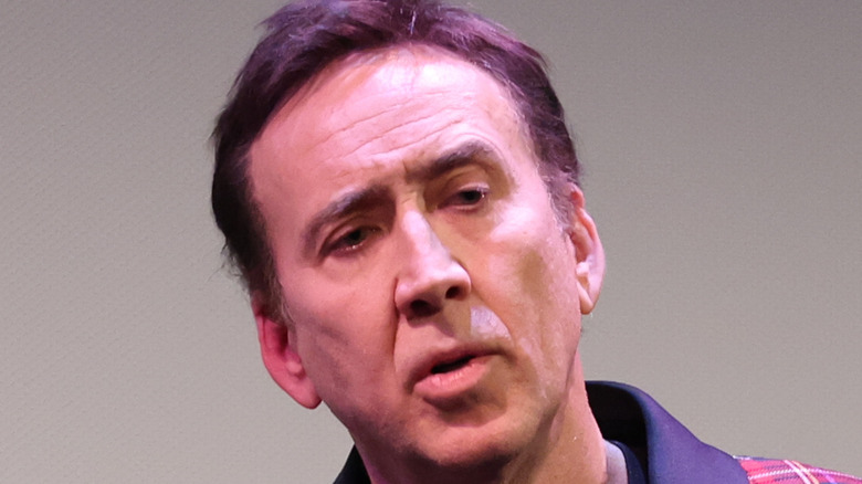 Nicolas Cage onstage at an event
