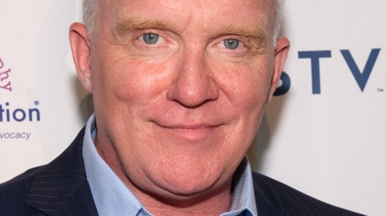 Anthony Michael Hall smirks