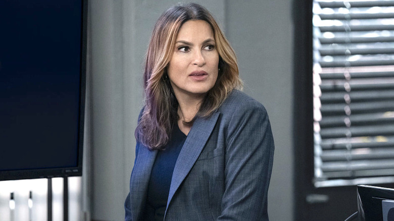 Benson wearing a suit