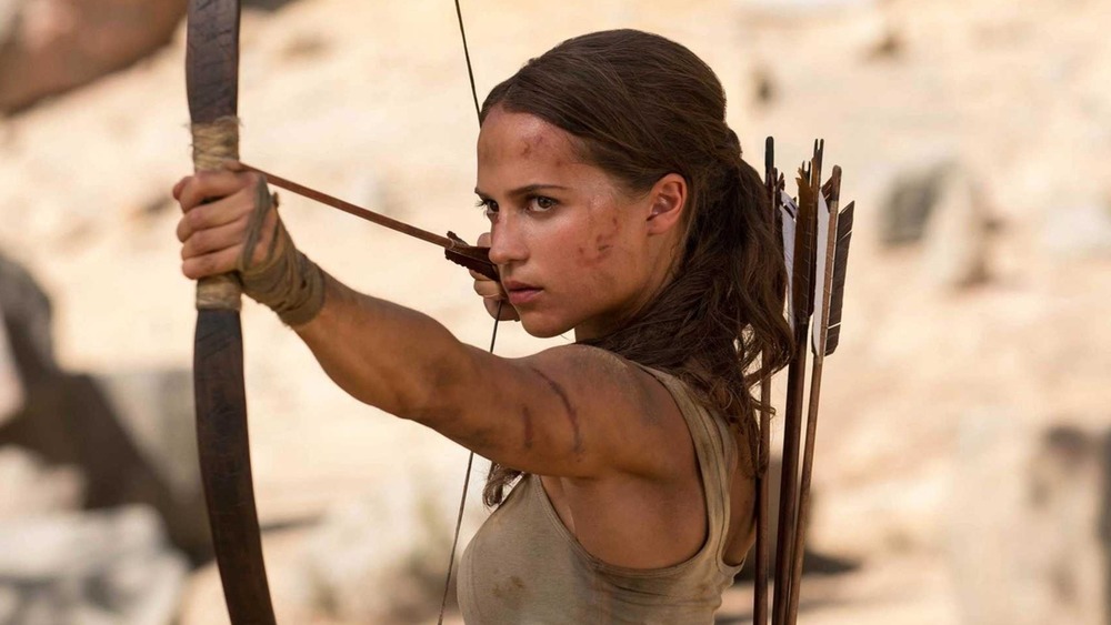 Lara Croft holding a bow and arrow