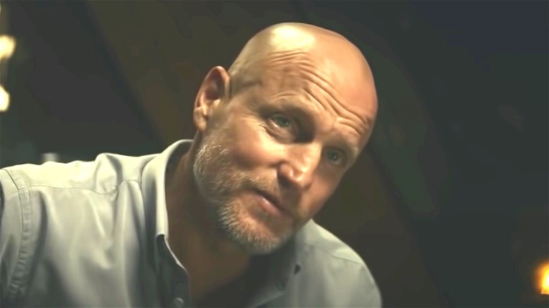 Woody Harrelson smirking in Kate