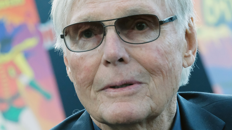 Adam West wearing glasses