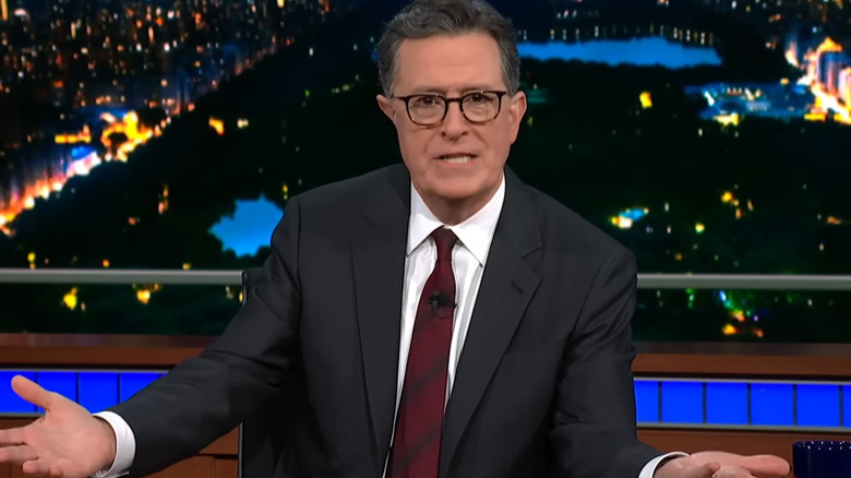 Stephen Colbert talking behind his desk on "The Late Show with Stephen Colbert" (2015-present)