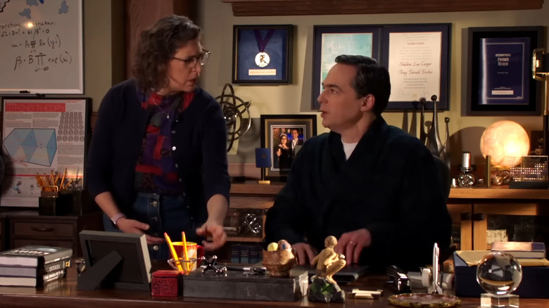 Amy Farrah Fowler and Sheldon Cooper in his office