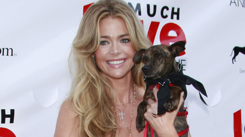 Richards holding a dog