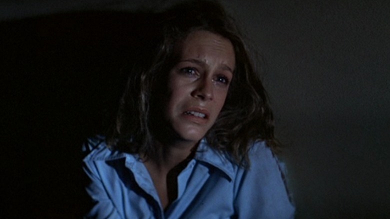 Laurie cowers in fear
