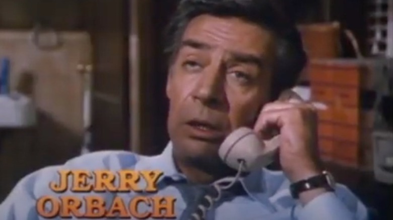Jerry Orbach talking on the phone as Harry McGraw