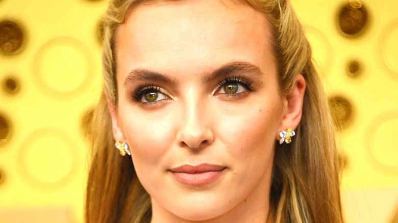 Jodie Comer smiling wearing earrings