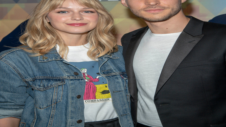 Melissa Benoist and Chris Wood smiling