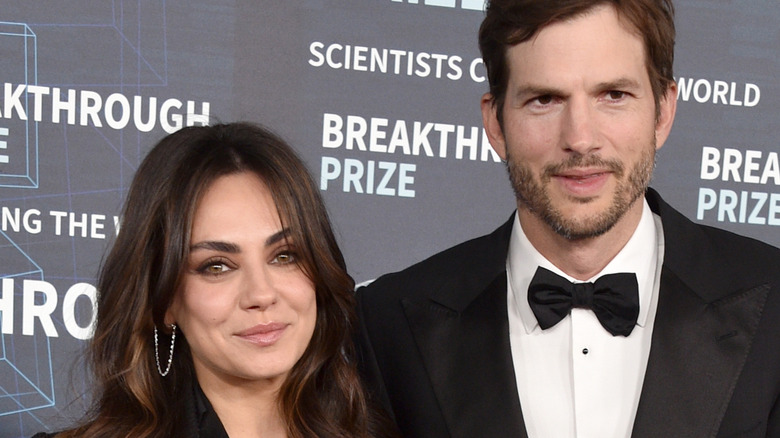 Mila Kunis and Ashton Kutcher pose for photos